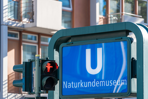 Germany, Berlin, October, 18, 2023 - Pedestrian traffic light against U-Bahn sign Naturkundemuseum, Berlin central