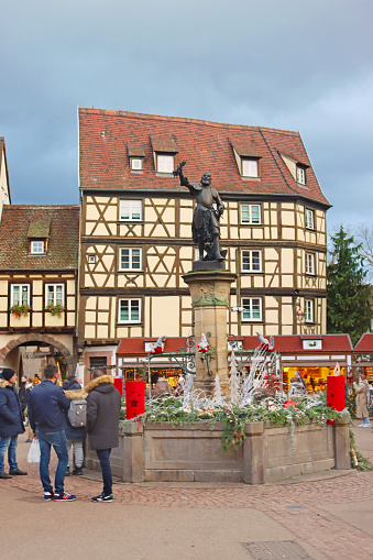 Colmar, France - December 21, 2023: Schwendi fountain by Bartholdi on Old Customs Square