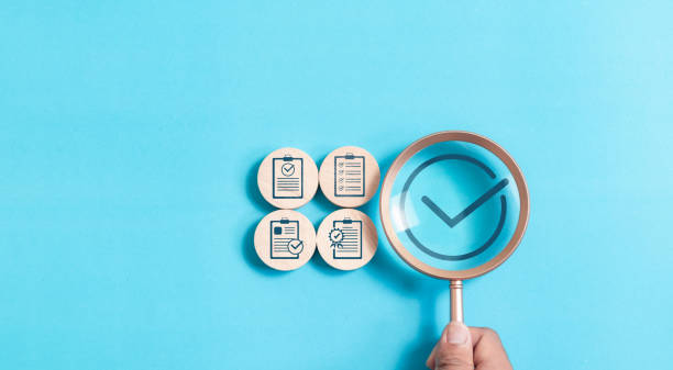 istock Document approval concept. Magnifying glass focus to approved document icon on for approve business project proposals. Quality assurance and evaluation of business concept. 2013008507