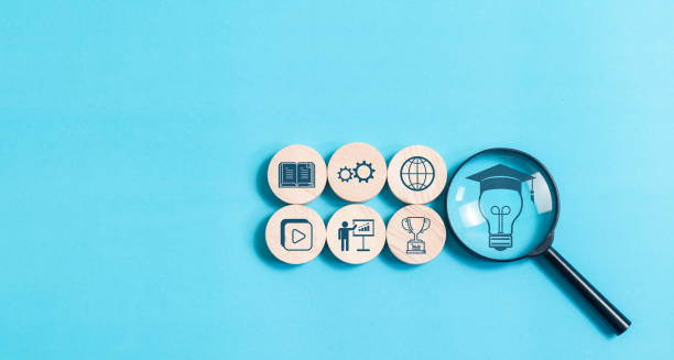 istock Magnifying glass focus to online education concept on blue background, E-learning education, internet lessons and online webinar. 2013011241