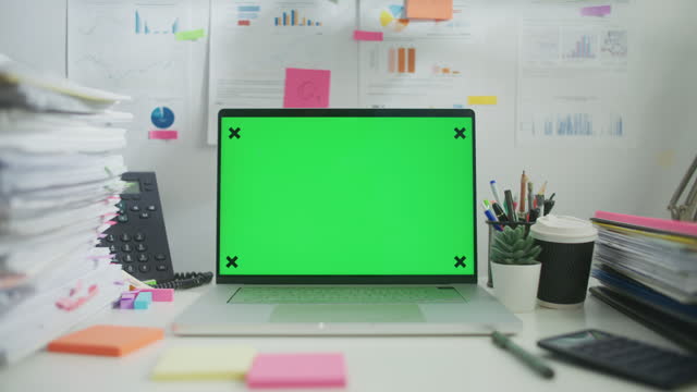 Zoom in of Laptop green screen on work desk, No people