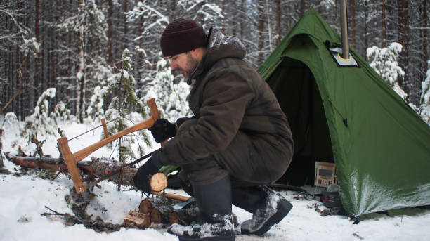 istock Winter camping with a tent. Tent in winter landscape. 2013029481