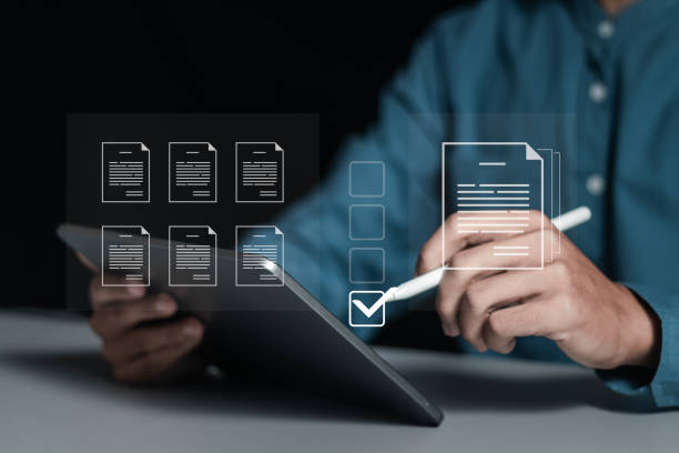 istock Businessman working on tablet to document management online for checklist and clipboard task management, filling survey form online, answer questions of test. Survey form concept. 2013043326