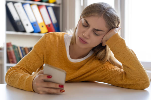 istock Woman bored of using her smartphone 2013051101
