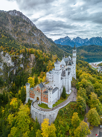 Neuschwanstein Castle is a 19th-century historicist palace on a rugged hill of the foothills of the Alps in the very south of Germany.