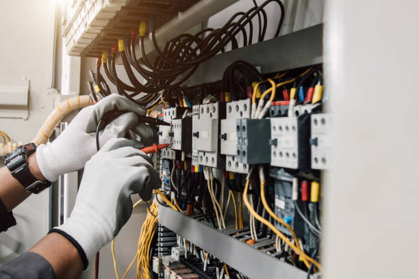 istock Electrician engineer tests electrical installations and wires on relay protection system. 2013083886