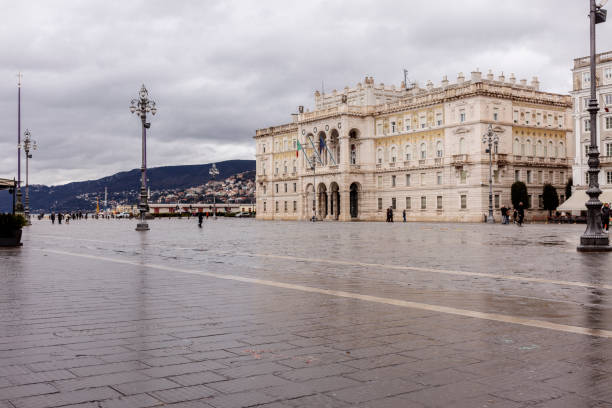 Trieste, Italy - February 11, 2024: The main square (Piazza Unità d'Italia) on a rainy day.