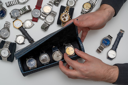 Group of vintage automatic and quartz watches on white background