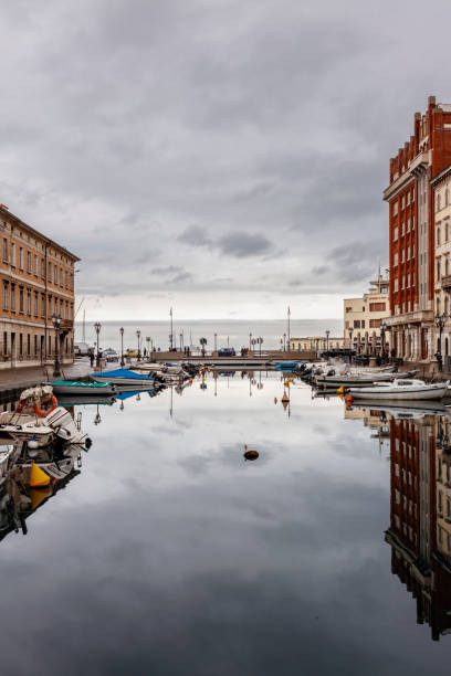 Trieste, Italy - February 11, 2024: Canal Grande (great canal) on a cloudy day.