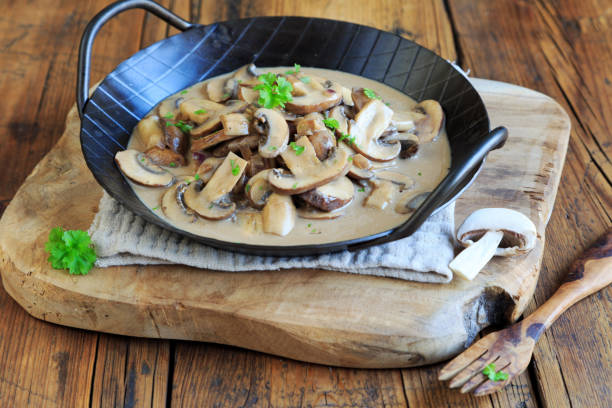 istock Mushrooms with cream sauce in an iron pan 2013090673