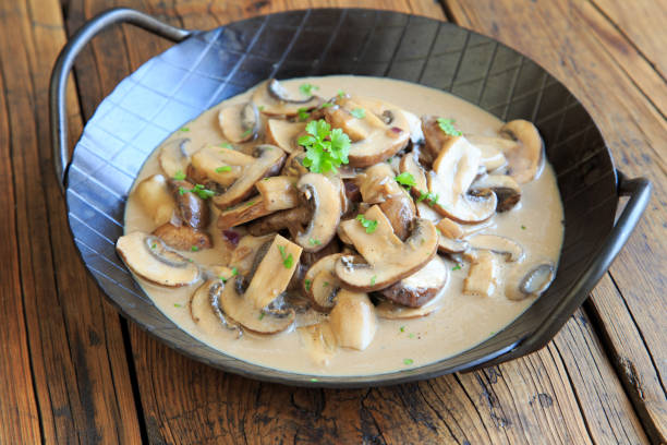 Bowl of Homemade Cream of Mushroom Soup garnished with sauteed Crimini Mushrooms