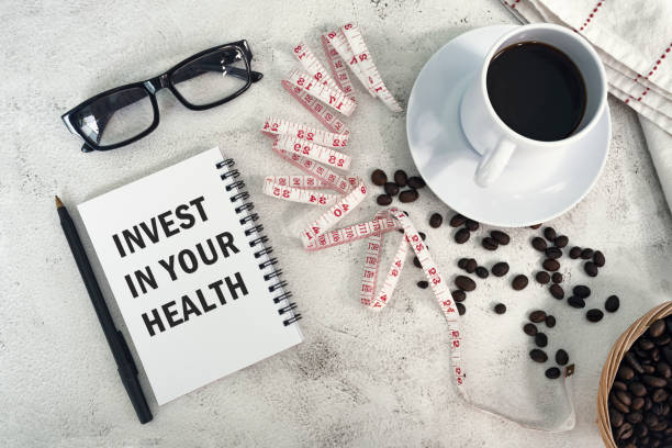istock INVEST IN YOUR HEALTH text written on a notebook. 2013102496
