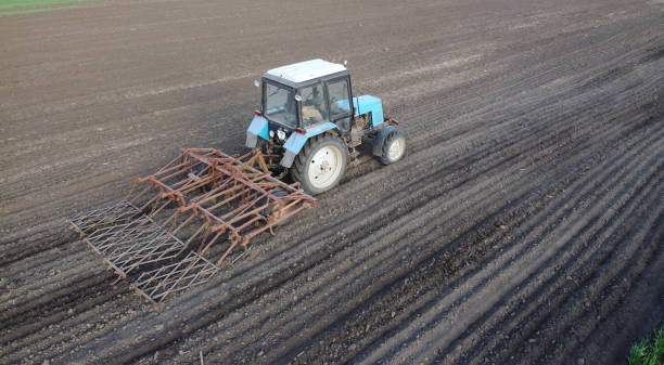 istock Farmer in tractor preparing land with seedbed cultivator at spring 2013117880