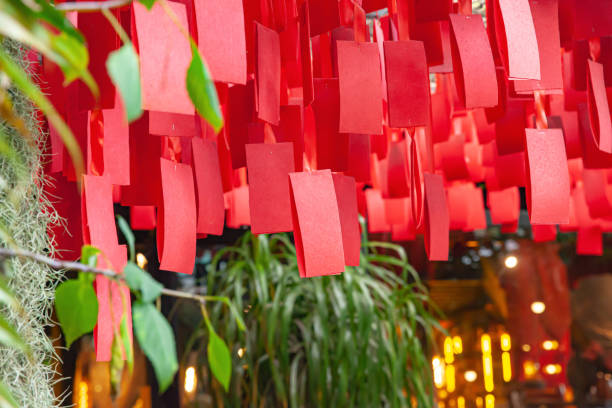 istock Colorful red paper decorations hanging from the ceiling in a temple for a celebration 2013132615