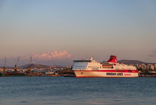 Heraklion, Crete, Greece - October 1, 2023: A picture of a Minoan Lines ferry at the Heraklion Port, at sunset.