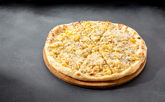 Four cheese pizza with a rich blend of creamy and flavorful cheeses on a golden crust, an Italian classic.