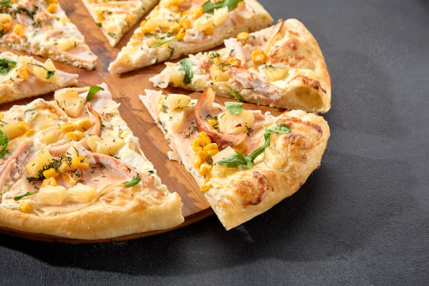 istock Hawaiian pizza with chicken, pineapple, and corn, a sweet and savory combination on a perfectly baked crust 2013145746