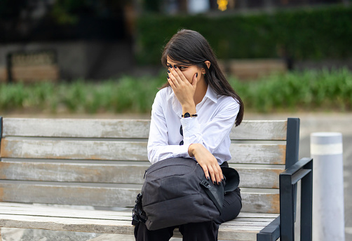 Woman frustrated on a bench