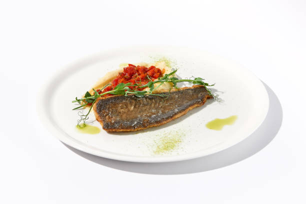 istock Pan-Seared Trout Fillet with Potato Puree and Tomato Salsa on White, a Fresh Take on Classic Seafood Dishes 2013157010