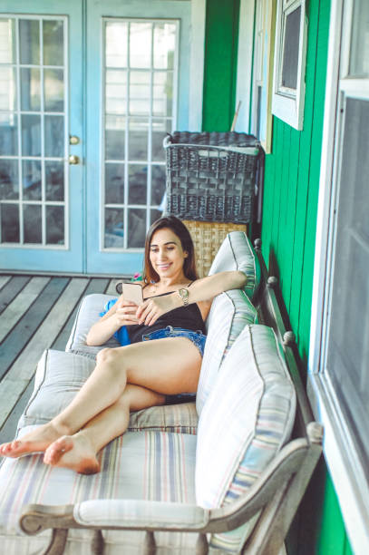 Happy young woman using a phone