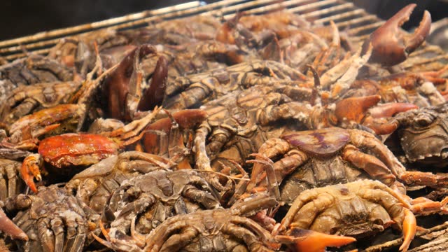 Grilling rice paddy crabs, street food, Thailand
