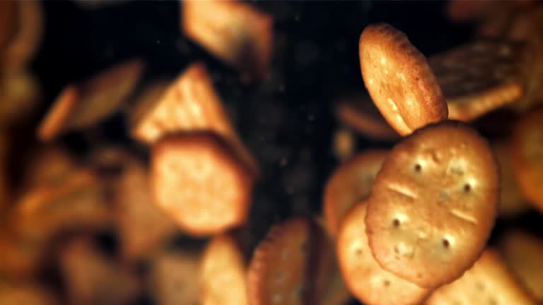 Cookies fly up and fall down. Filmed on a high-speed camera at 1000 fps.