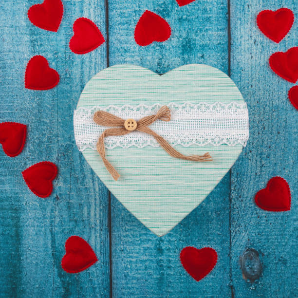 istock Valentines day greeting card template. Gift boxes, heart decor over blue wooden background. Top view flat lay with copy space 2013247965