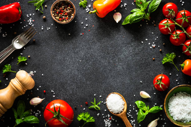 istock Food cooking background on black stone table. 2013259899