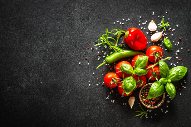 istock Food cooking background on black stone table. 2013260443