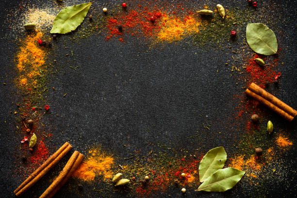 istock Spices and herbs on black slate background. 2013266278