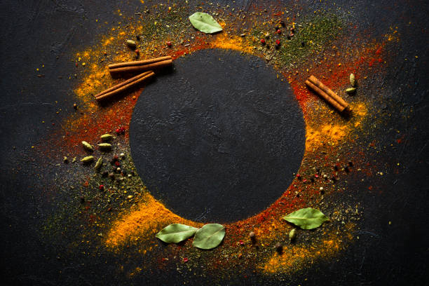 istock Spices and herbs on black slate background. 2013266279