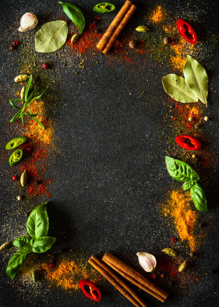 istock Spices and herbs on black slate background. 2013266793