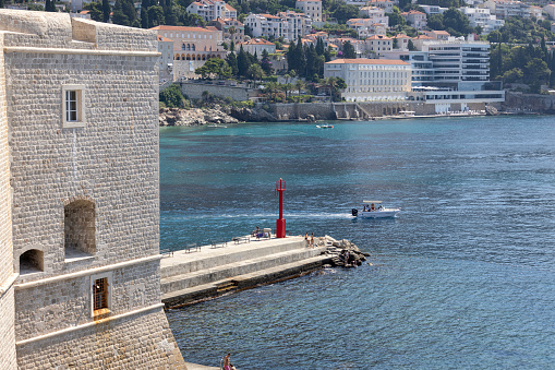 Dubrovnik; Croatia - June 27; 2023: View from city walls with Bastion of St. John of the Porporela pier in the port of Dubrovnik