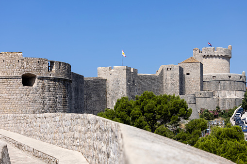 Dubrovnik, Croatia - June 27, 2023: Minceta, fortified tower on City Walls surrounding the mediaval old city by Adriatic Sea