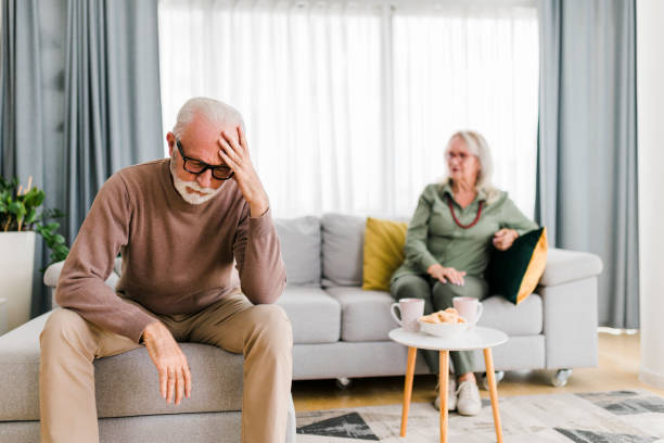 istock Senior heterosexual couple are quarreling while sitting on couch at home. 2013283310