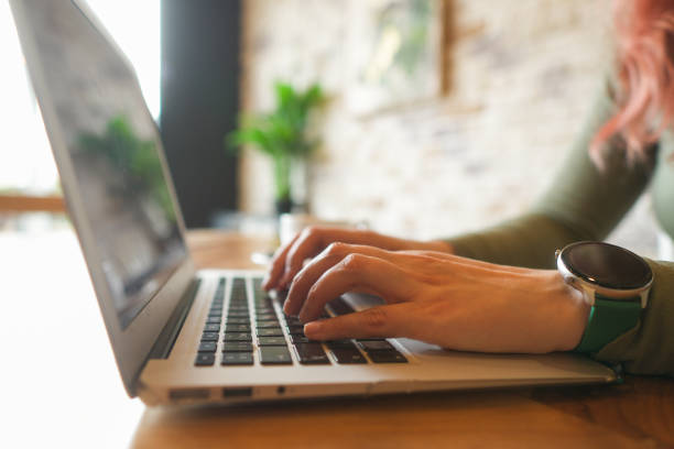 istock Close-up of hands typing on a laptop 2013295540