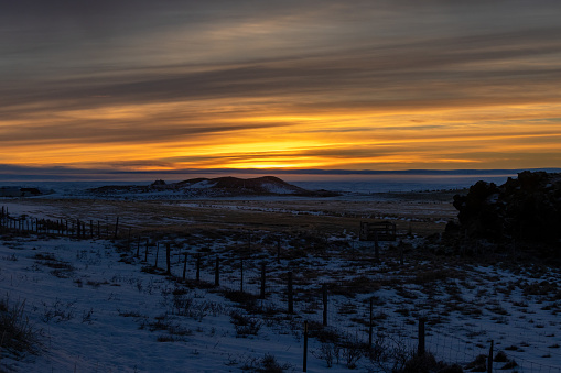 Colorful sunset at the lake. Littlebit of snow on the coast. Sky with clouds in the autumn. Slight fog. Myvatn, North Iceland.