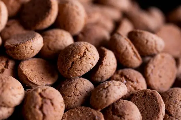 A closeup portrait of a delicious dutch treat called pepernoten. Pepper nuts are a traditional cookie during holidays and saint nicholas or sinterklaas in dutch and it tastes like gingerbread.