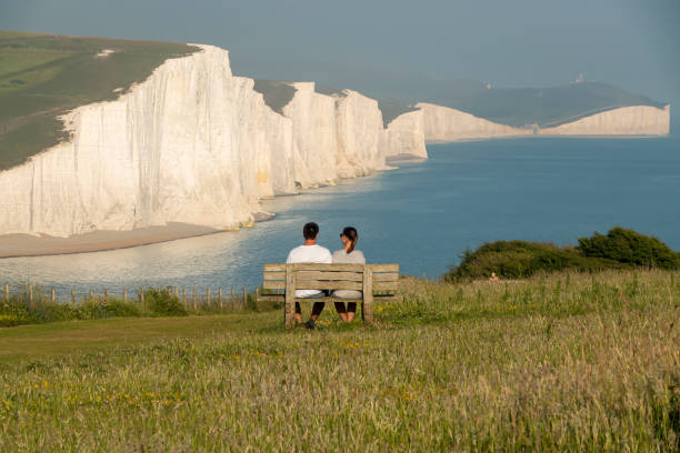 istock Young holidaymakers admire extraordinary seascape with beautiful chalk cliffs 2013309424
