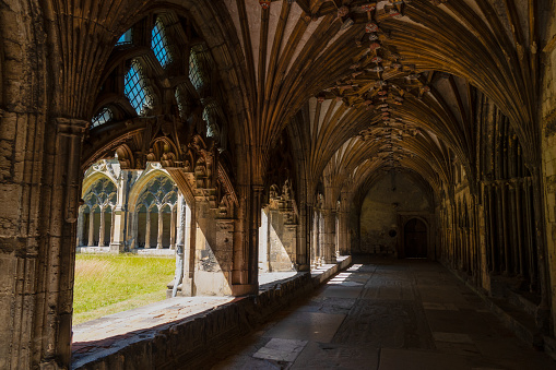 Cloister with magnificent gothic arches in northern part of Canterbury Cathedral. Stunning architectural details of a religious and pilgrimage building in England, which is under UNESCO protection.