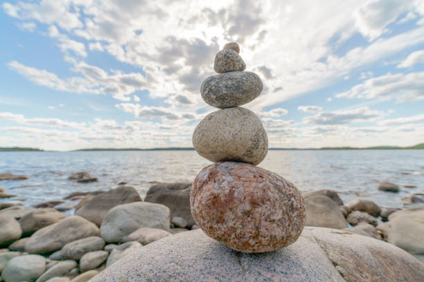 Pyramid of stones. Unstable balance of stone objects. Idyllic state of nature.