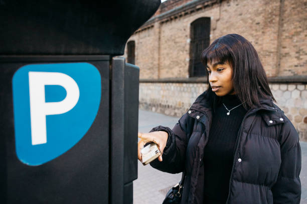 istock Woman making mobile payment for parking. 2013380193
