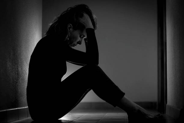 istock Woman sitting on the ground 2013420308