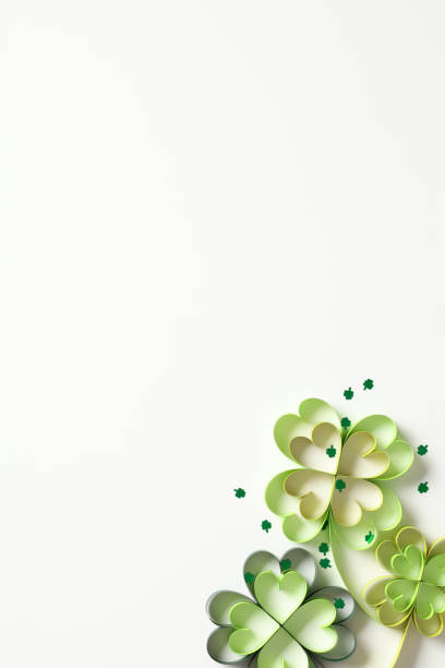 istock Four leaf clover paper art with confetti on white vertical background. St Patrick's Day concept. Top view, flat lay. 2013442060