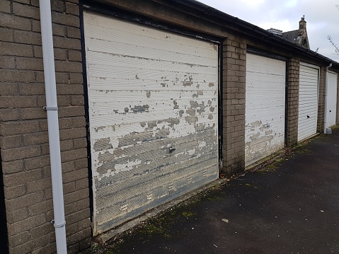 A row of white coloured garage doors, Glasgow Scotland England UK