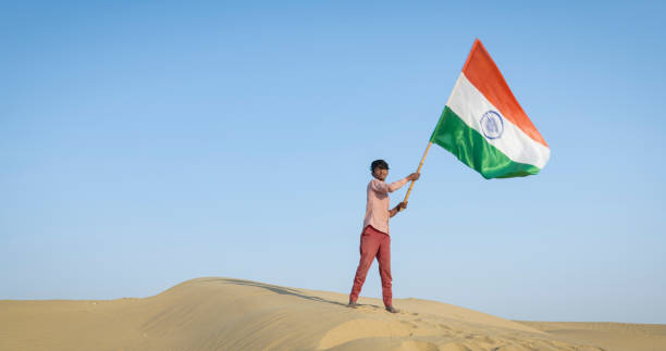 istock Young Indian boy waving Indian national flag, India 2013551738