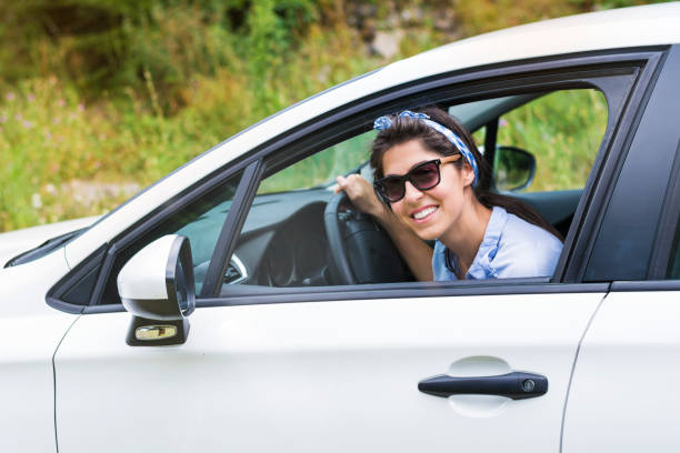 istock Woman learning to drive a car 2013576423