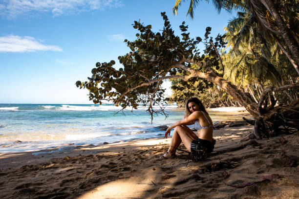 istock woman rests on paradise beach 2013608553
