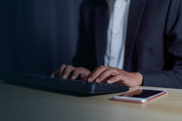 istock Businessman using internet technology around the world connecting Chatbot Chat with AI. Businessman using mobile app and laptop. 2013662589