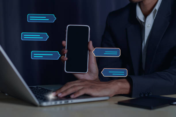 istock Businessman working on laptop revealing global data and email on smartphone screen.Web 3.0 digital technology concept 2013662592